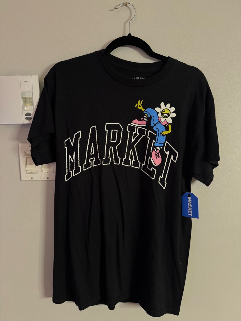 Chinatown Market Black Graphic Tee with Colorful Flower Character